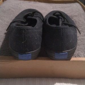 Black on black Keds sneakers